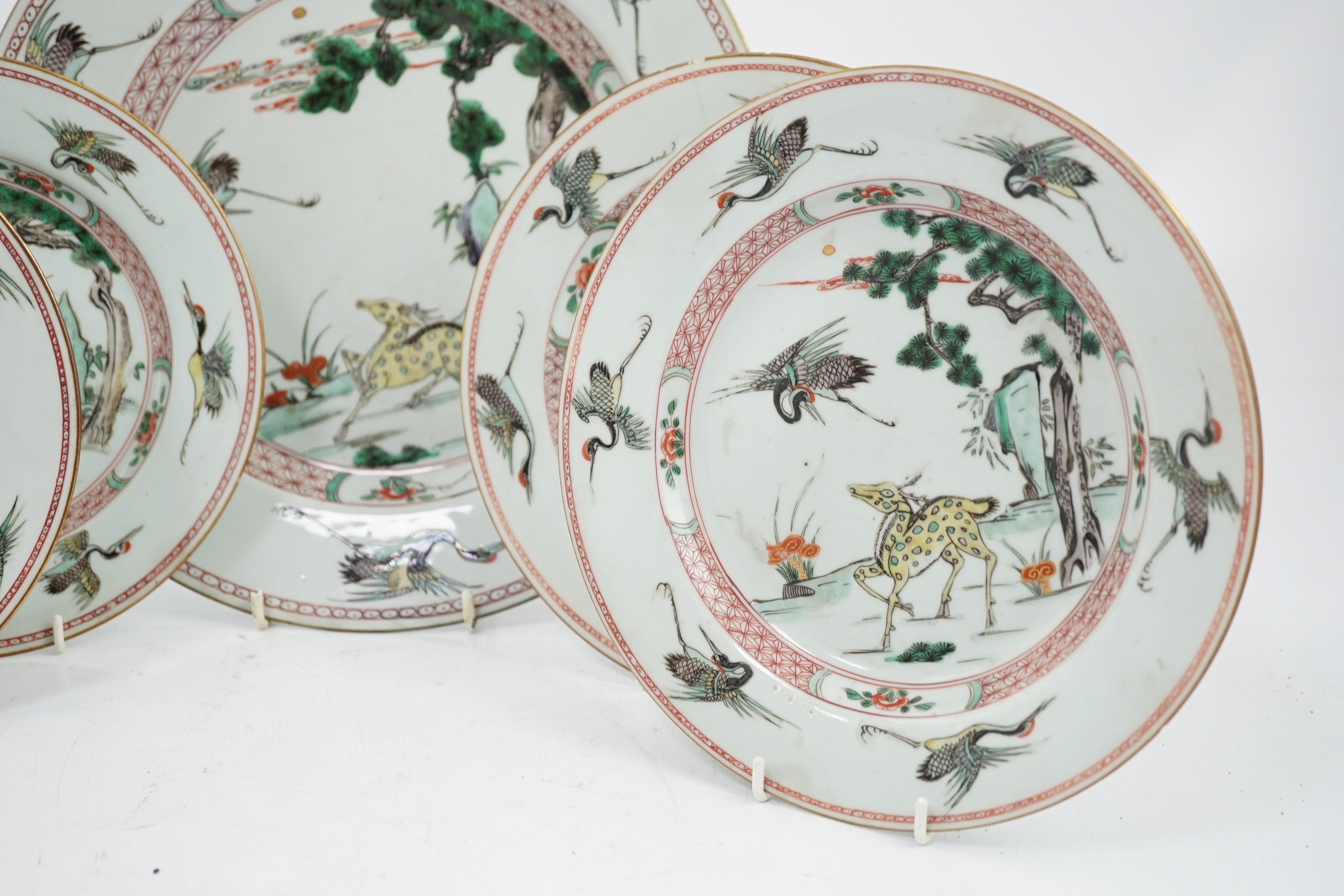 A Chinese famille verte ‘deer and crane’ dish and four matching plates, Kangxi period
